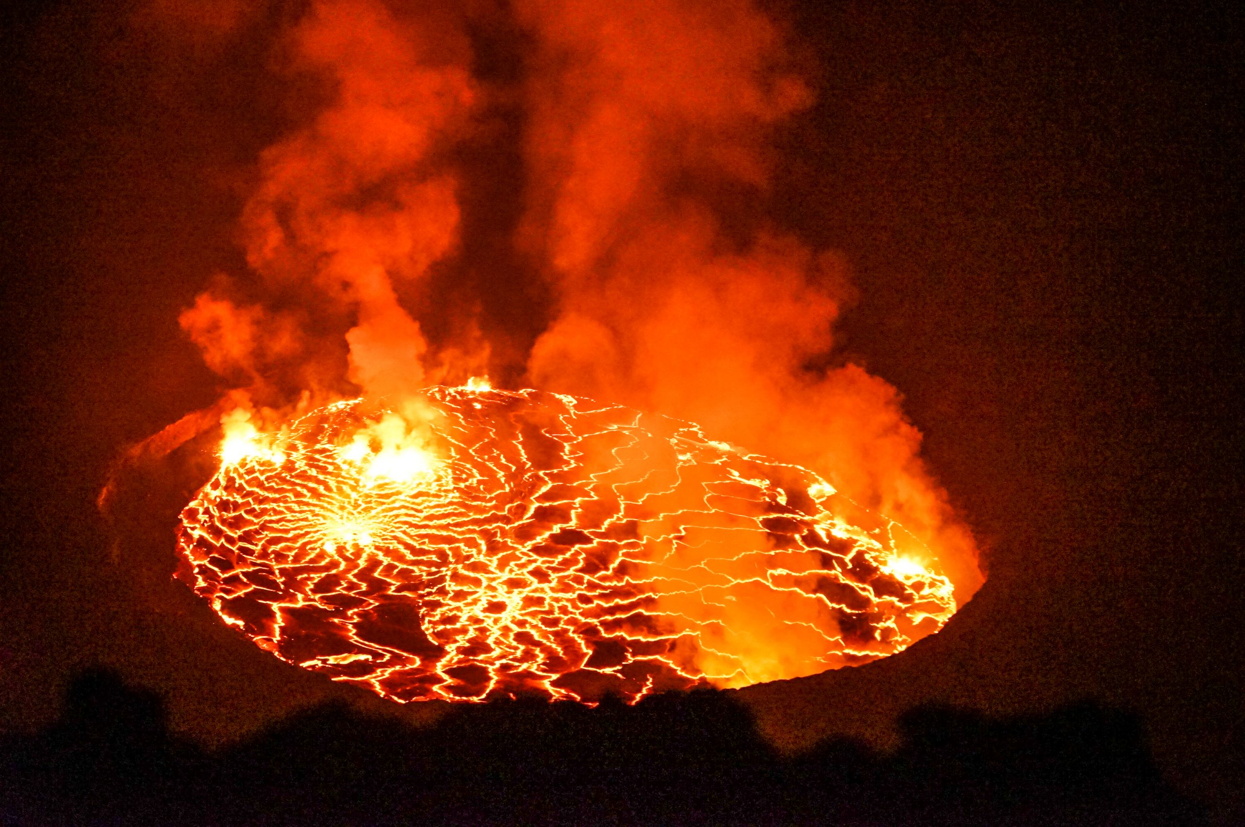 A photo of Mount Nyiragongo's glowing, smoking lava lake during the recent eruption