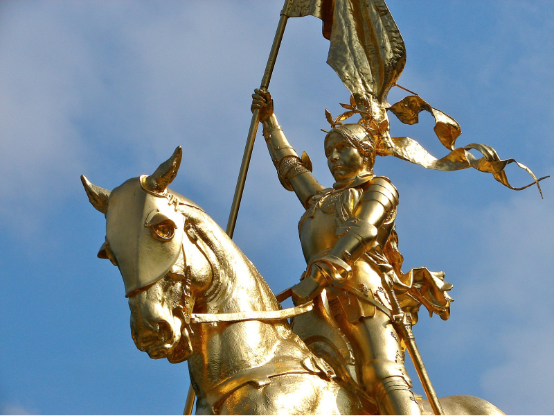Picture of a gold statue of Joan of Arc on horseback