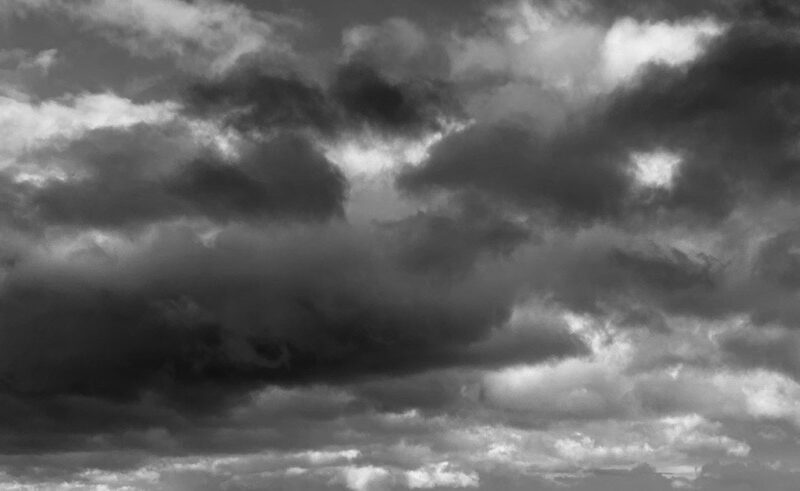 A black and white photograph of storm clouds.
