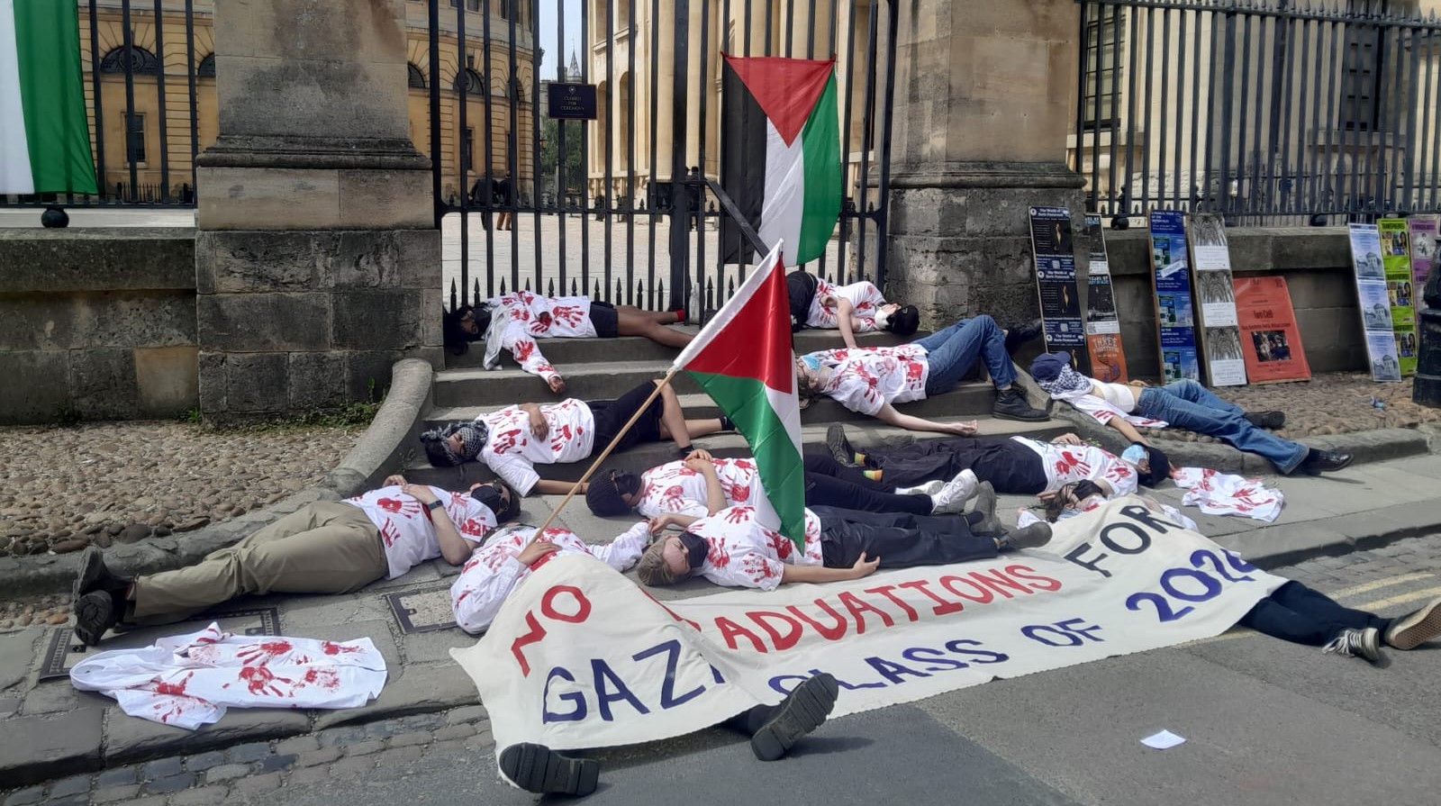 Image shows die-in outside entrance to Sheldonian Theatre.