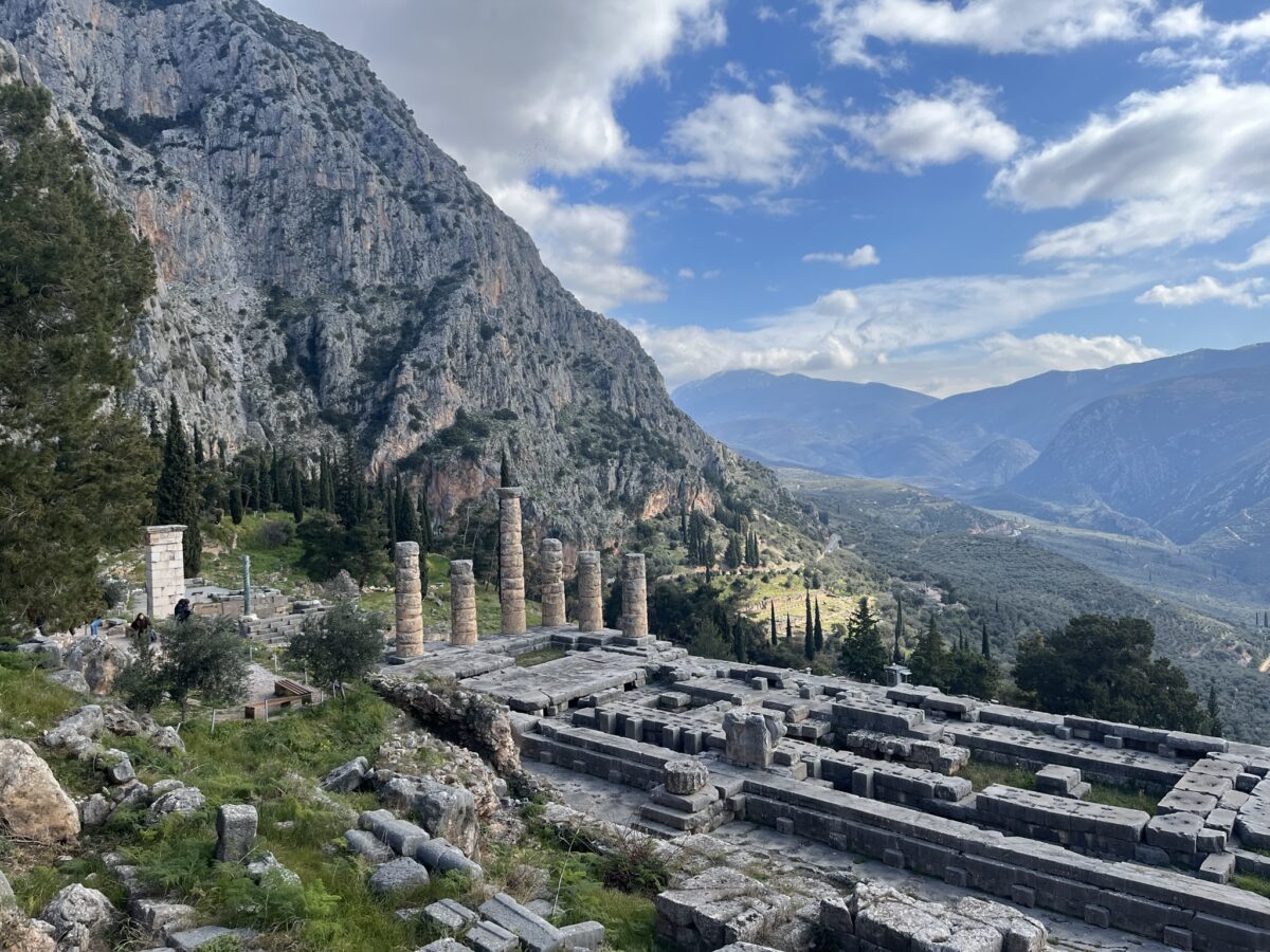 An image of Delphi against a blue sky with clouds