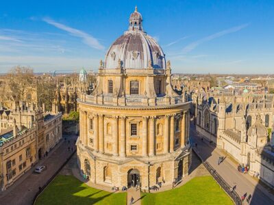 Radcliffe Camera, a cylindrical library in central Oxford, is pictured centrally among the Oxford skyline, as taken from University Church