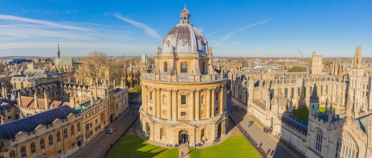 Radcliffe Camera, a cylindrical library in central Oxford, is pictured centrally among the Oxford skyline, as taken from University Church