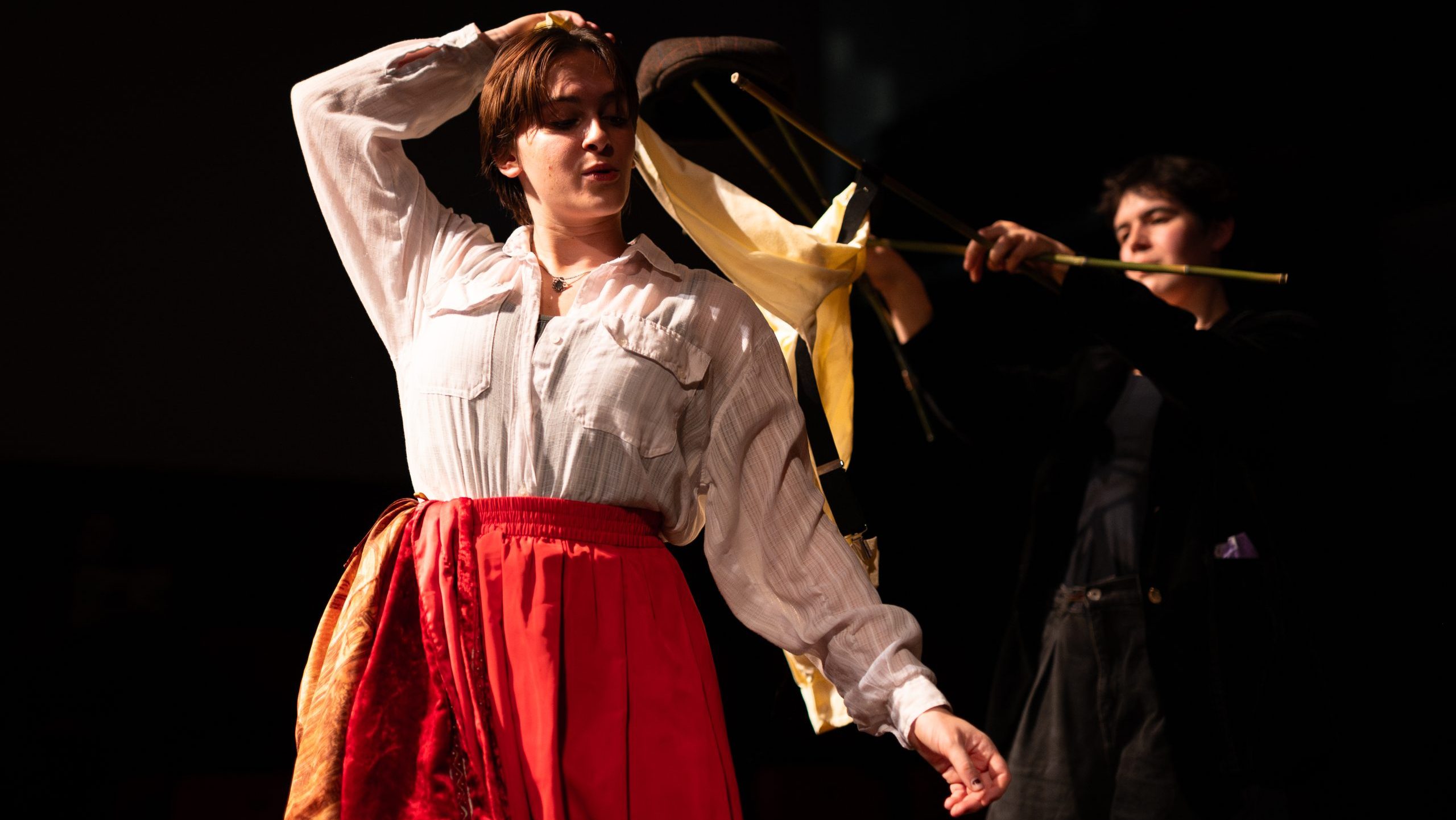 A photo of a cast member in costume, a puppet and a puppeteer