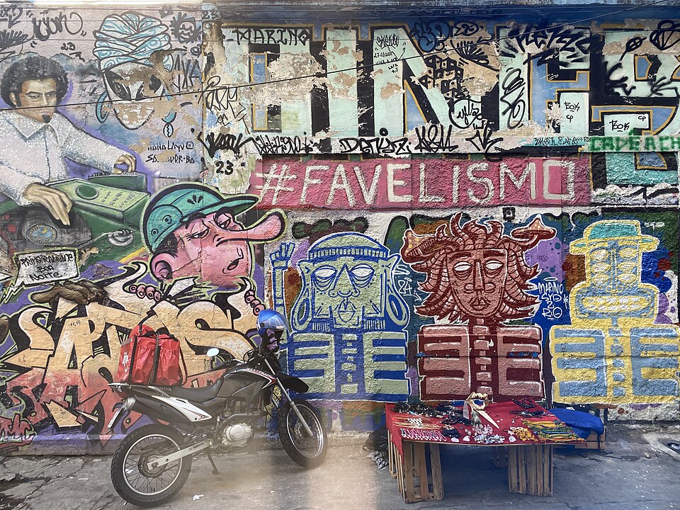 An image of a wall in Rio de Janeiro covered in graffiti, with #FAVELISMO at the forefront.