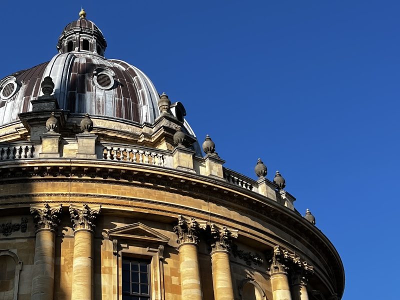 An image of the Radcliffe Camera against a blue sky