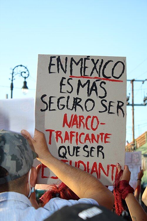 A poster during a protest in Mexico which says in Spanish: "In Mexico, it is safer to be a drug dealer than to be a student."