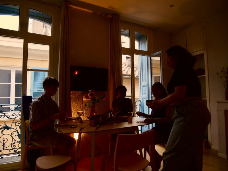 A group of friends setting up a meal together