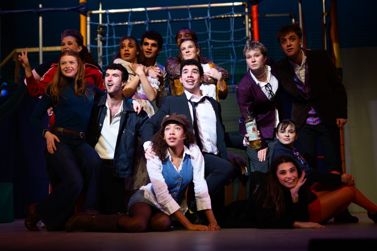 The cast of Company gathered together on the stage