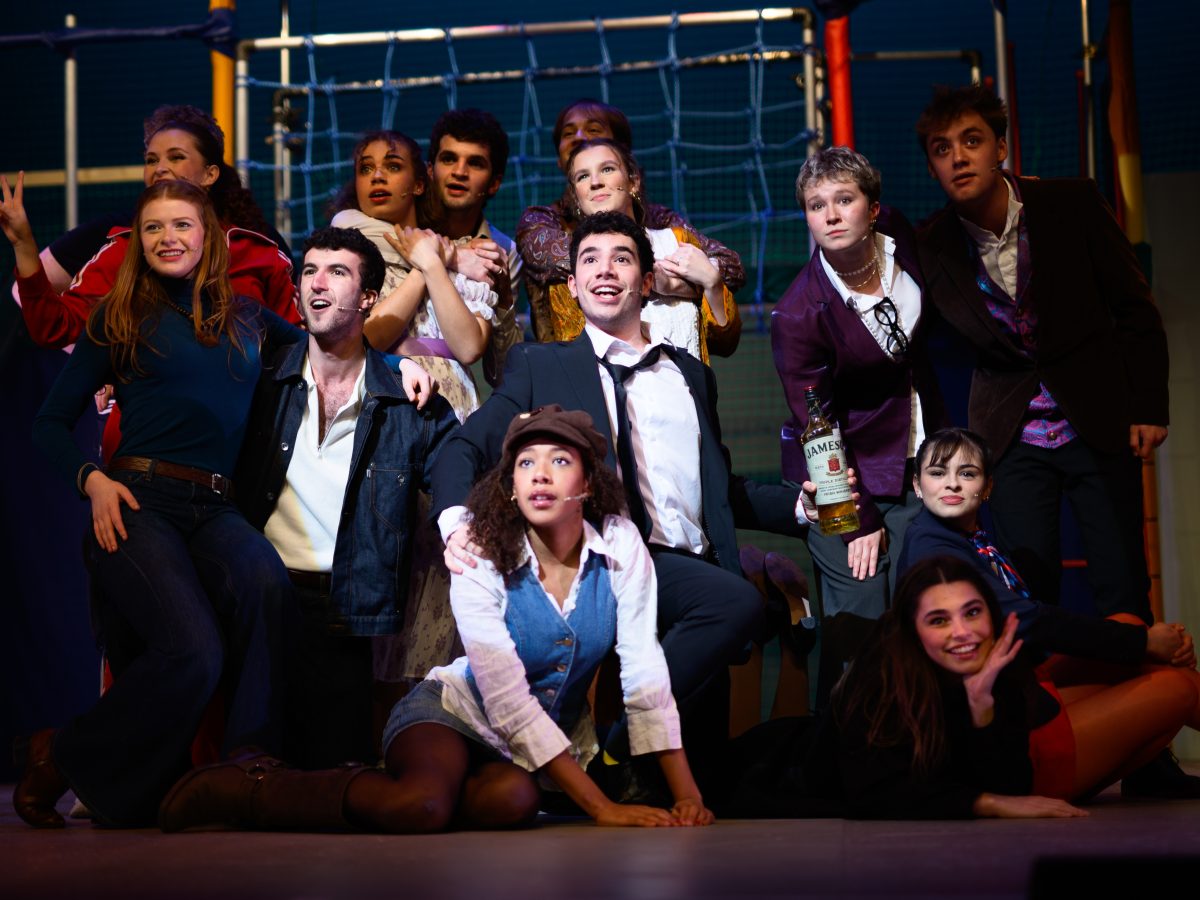 The cast of Company gathered together on the stage