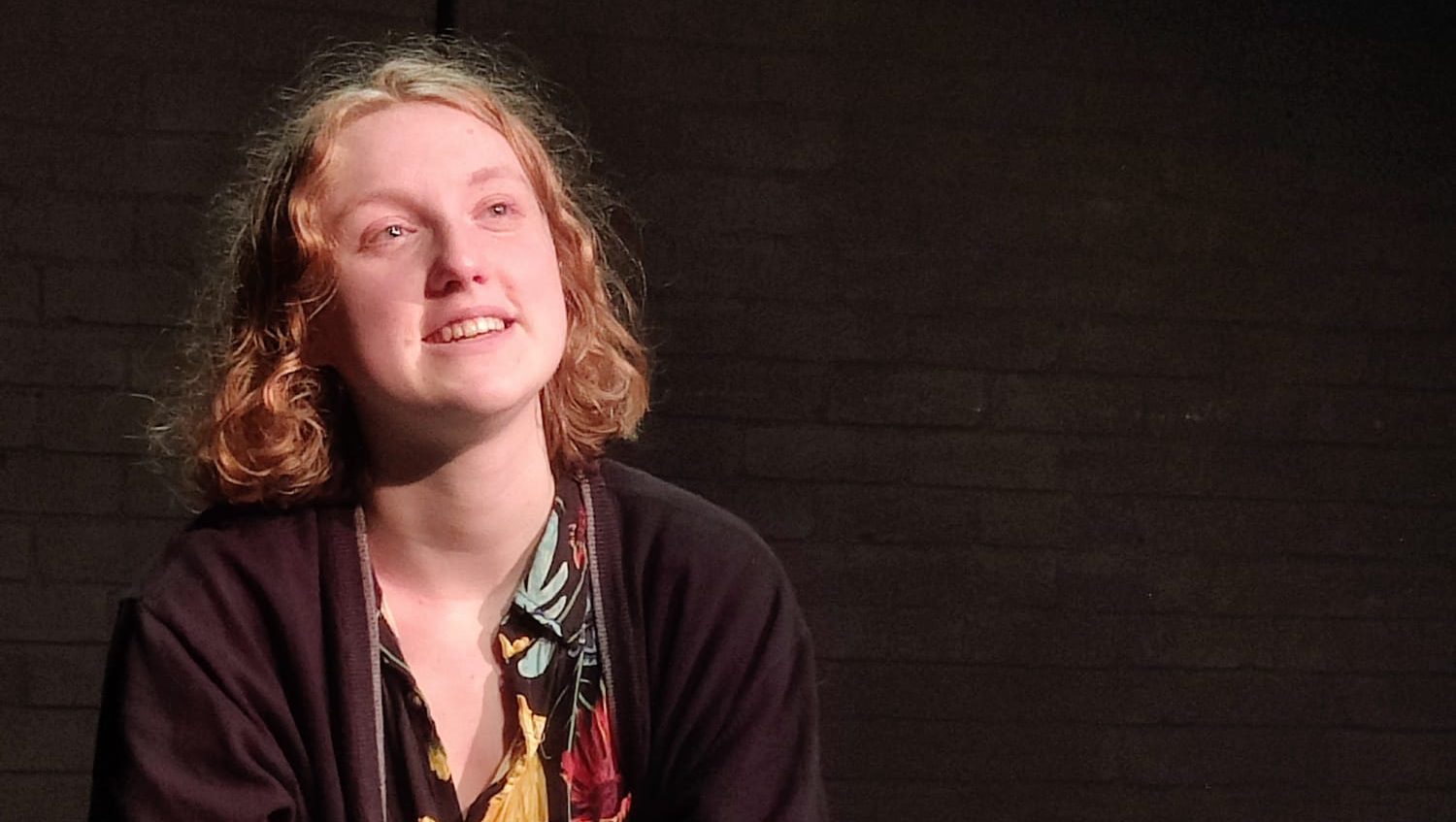 A person looks up above them dreamily.