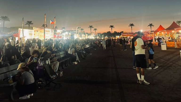 People outside at dusk.
