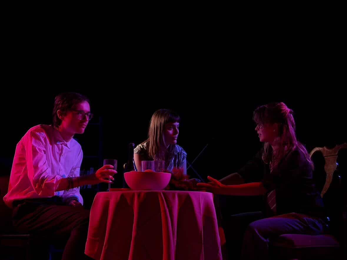 The three characters of Dependants, sat on a table.