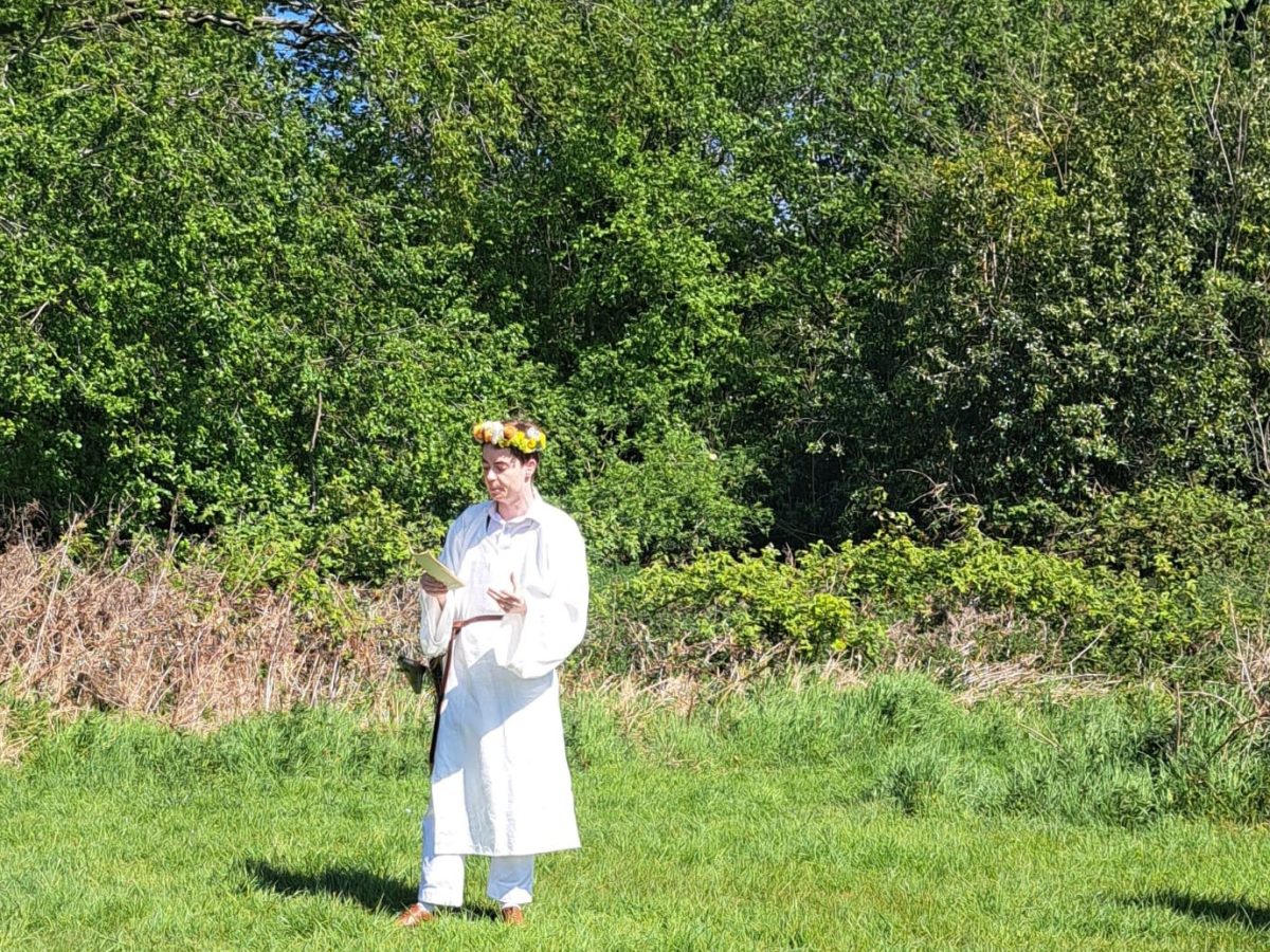 Person in medieval beekeeping attire.