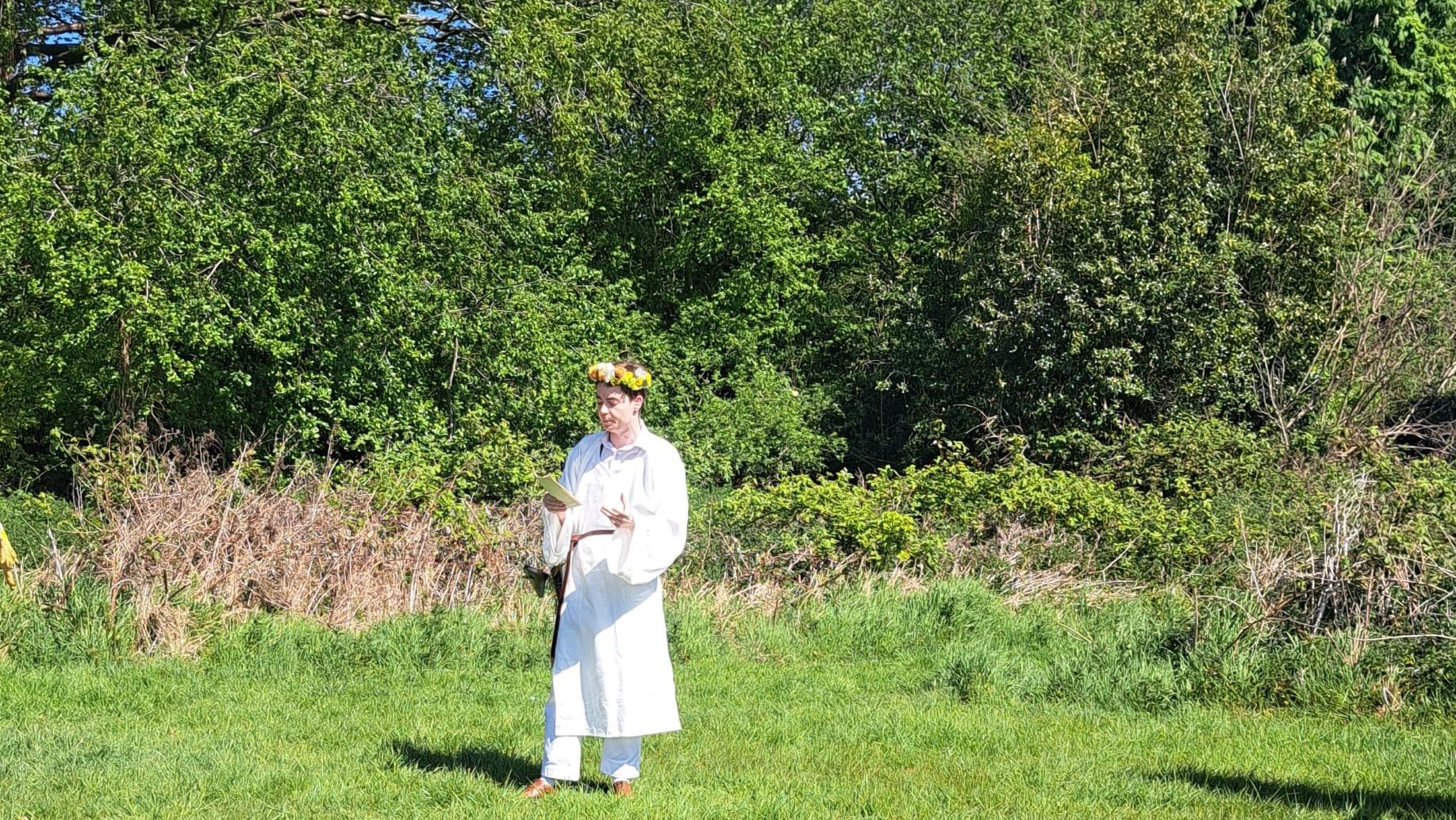 Person in medieval beekeeping attire.