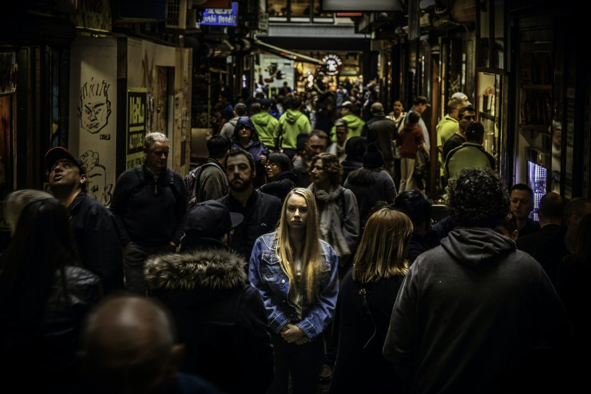 Credit: Mike Wilson. Lonely woman surrounded by many people, 23 July. 2016