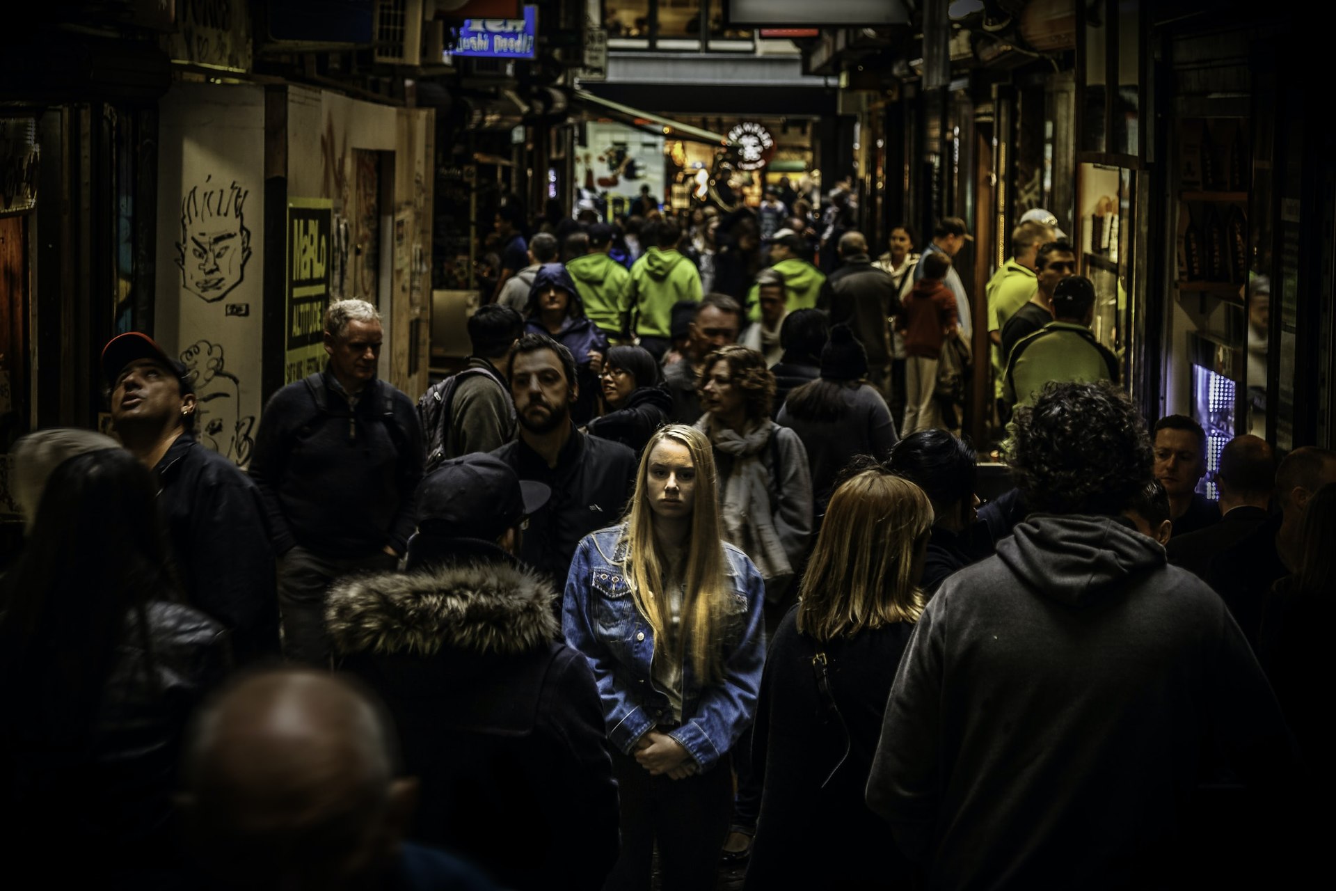 Credit: Mike Wilson. Lonely woman surrounded by many people, 23 July. 2016
