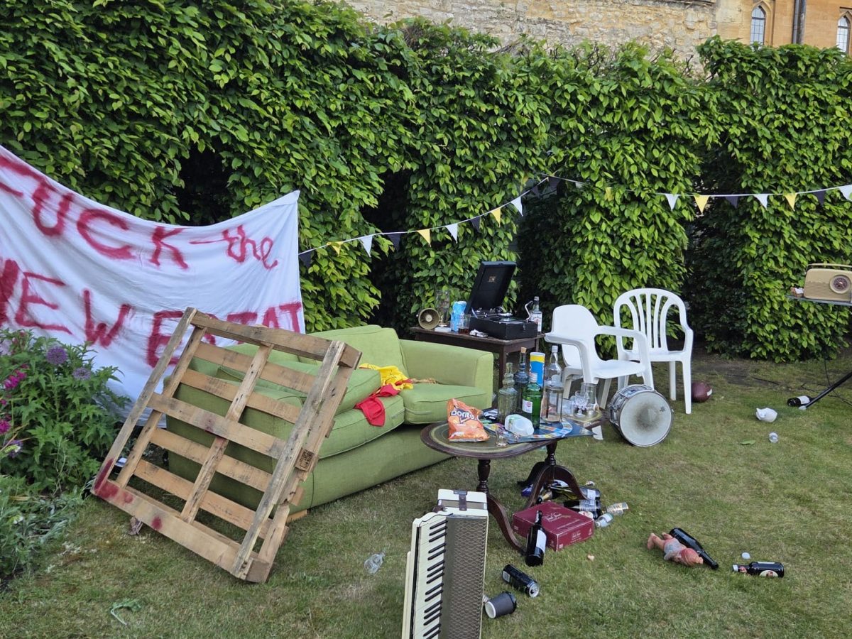 A garden, covered in litter and assorted furniture.