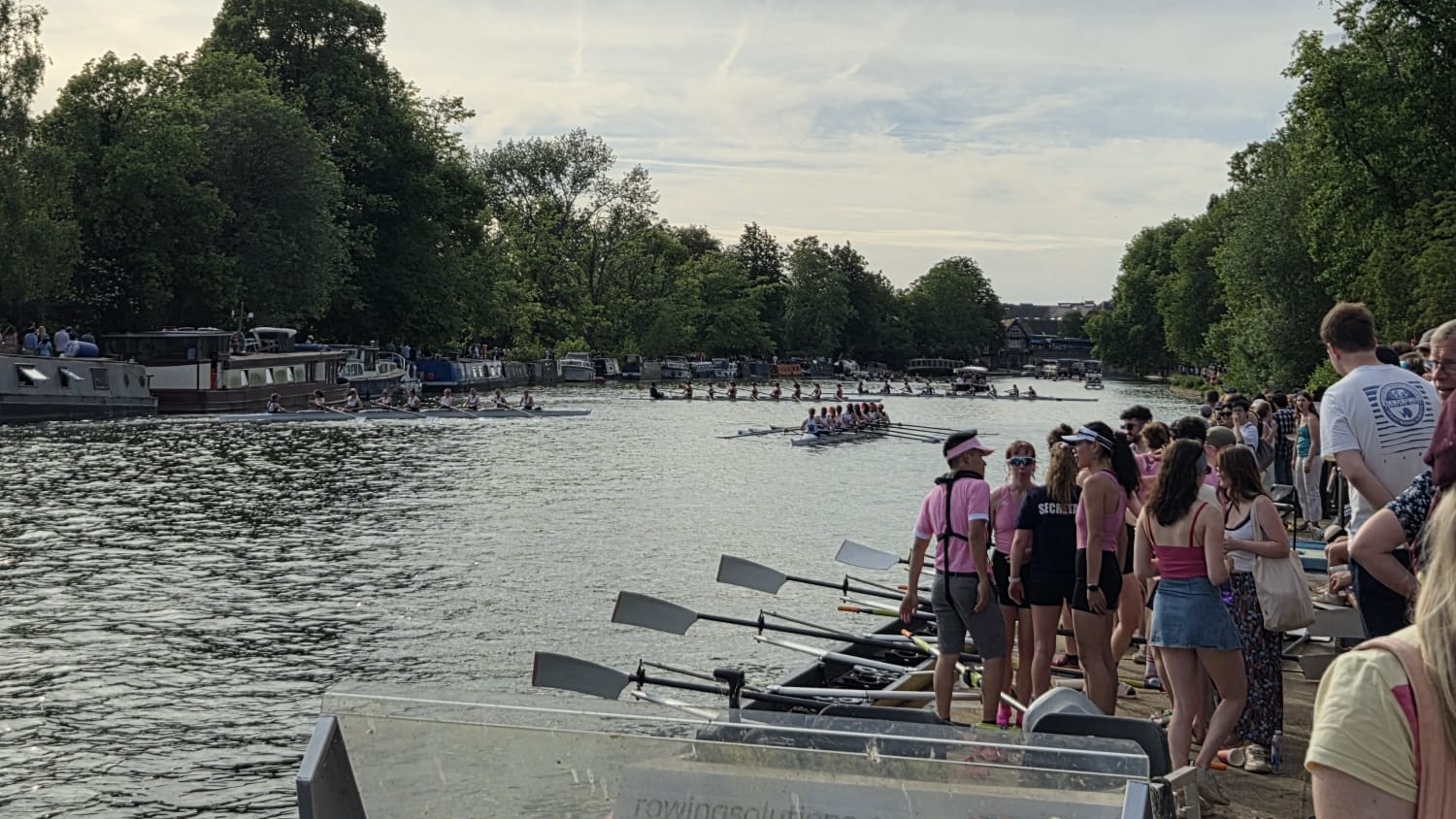 The Pembroke side, in pink, stand by the side of the Isis.