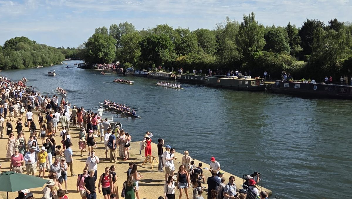 A view of the Isis with an onlooking crowd.