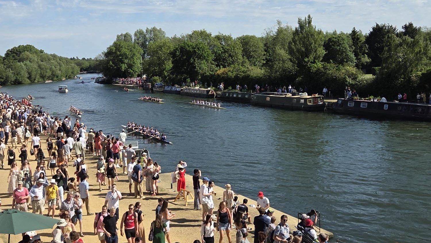 A view of the Isis with an onlooking crowd.