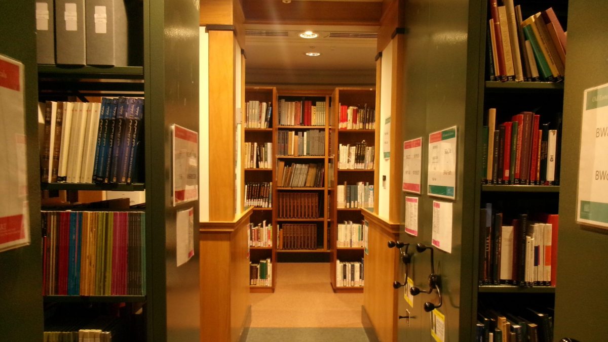 An empty library between the bookshelves.