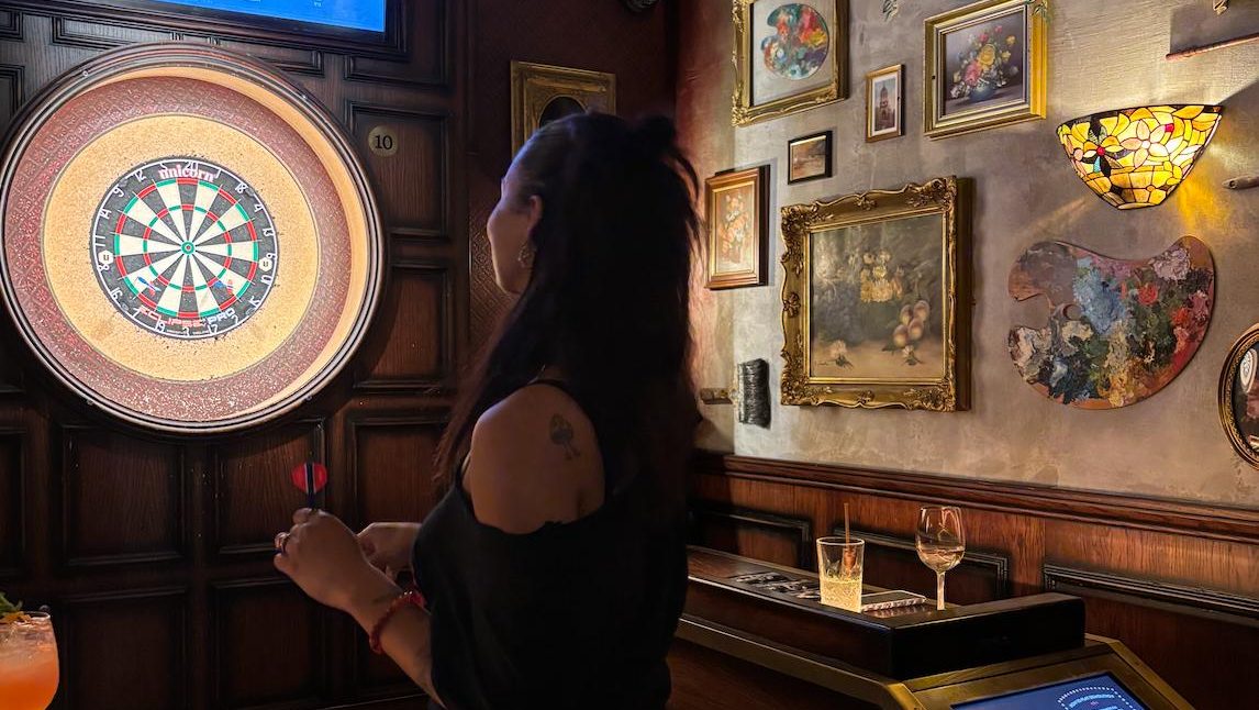 A person playing darts
