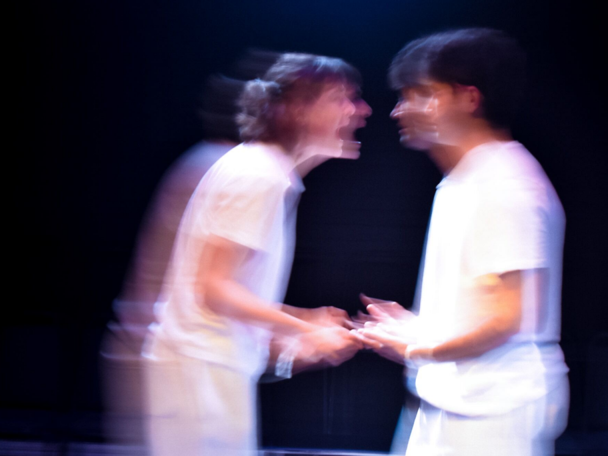 The two characters of The Effect, blurred and in argument