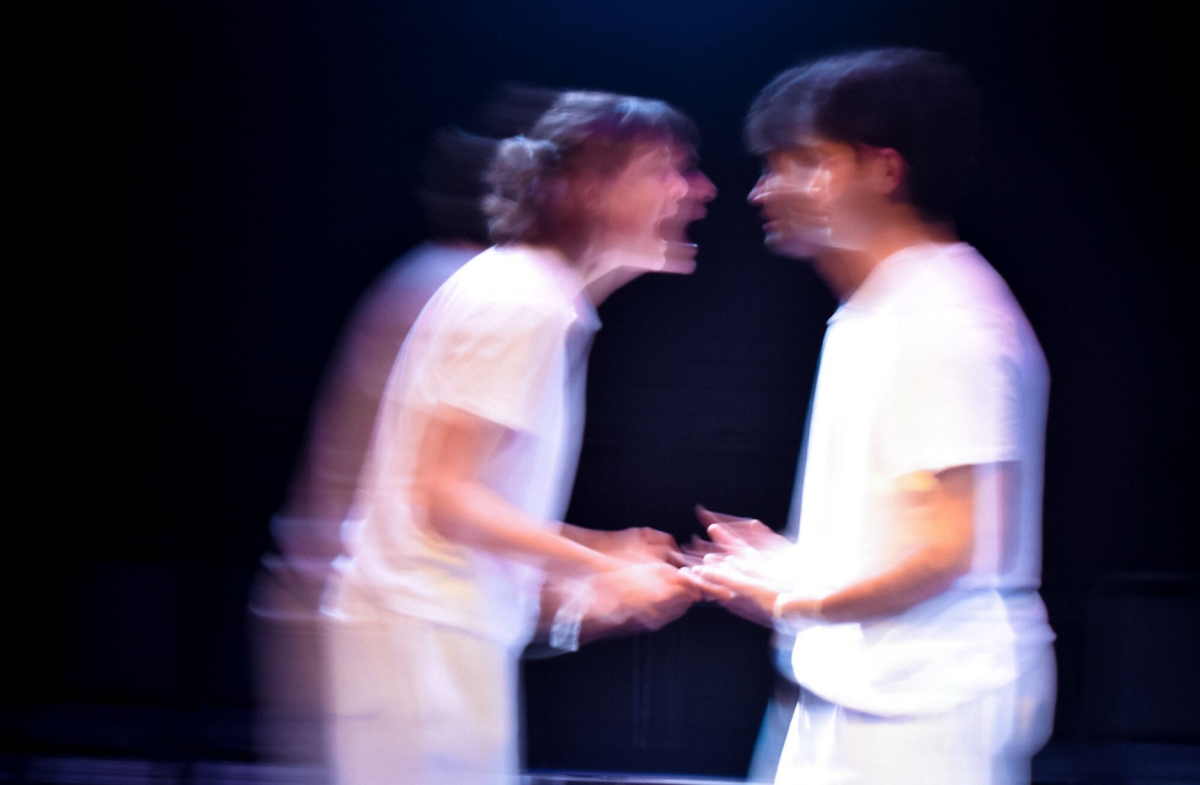 The two characters of The Effect, blurred and in argument