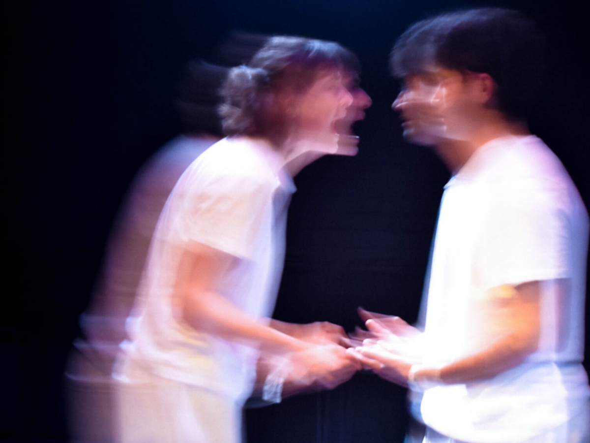 The two characters of The Effect, blurred and in argument