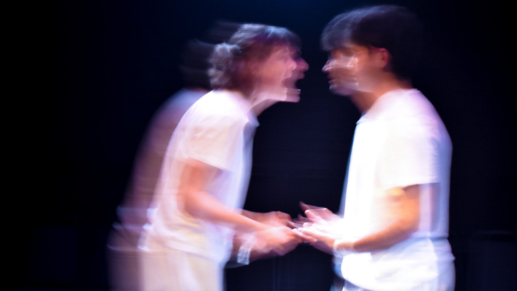 The two characters of The Effect, blurred and in argument