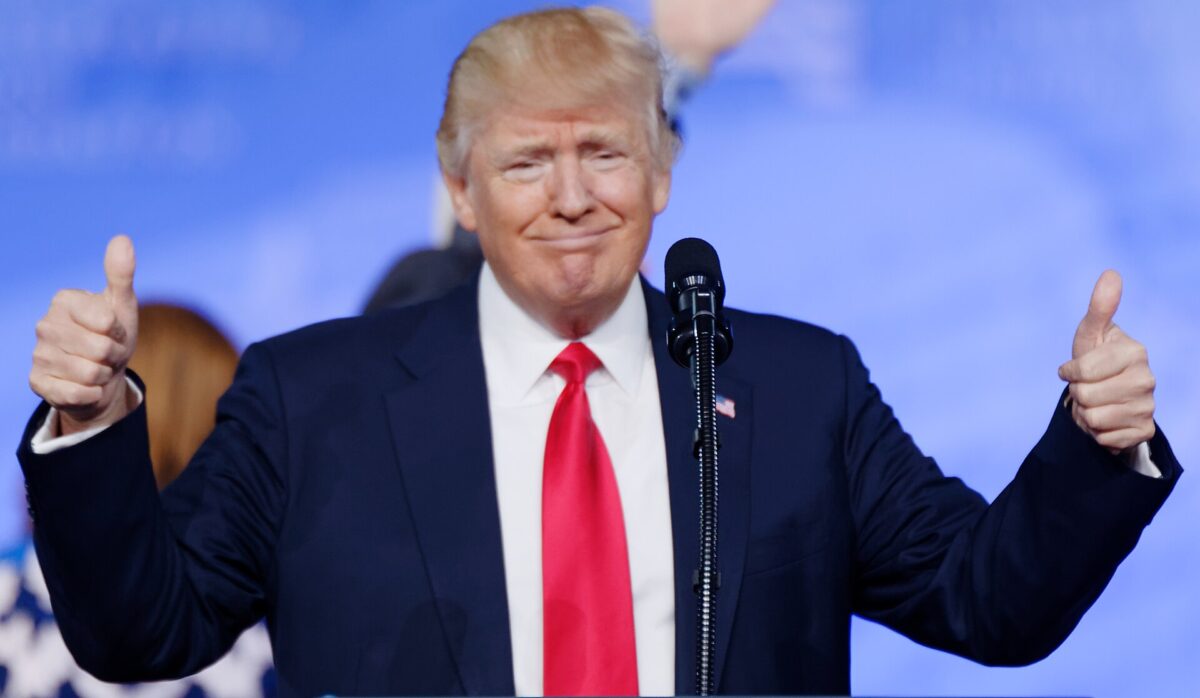 Donald Trump smiling, with his thumbs up.