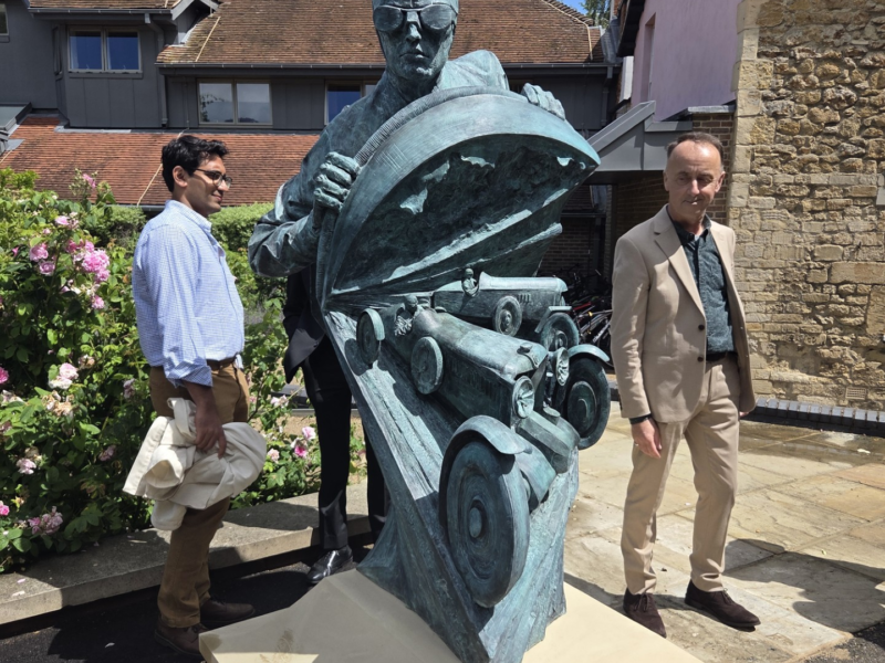 Paul Day's statue, depicting one MG racecar being overtaken by another