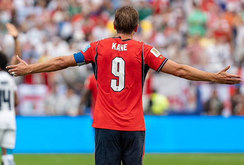 Harry Kane turns away from the camera to celebrate in front of the crowd