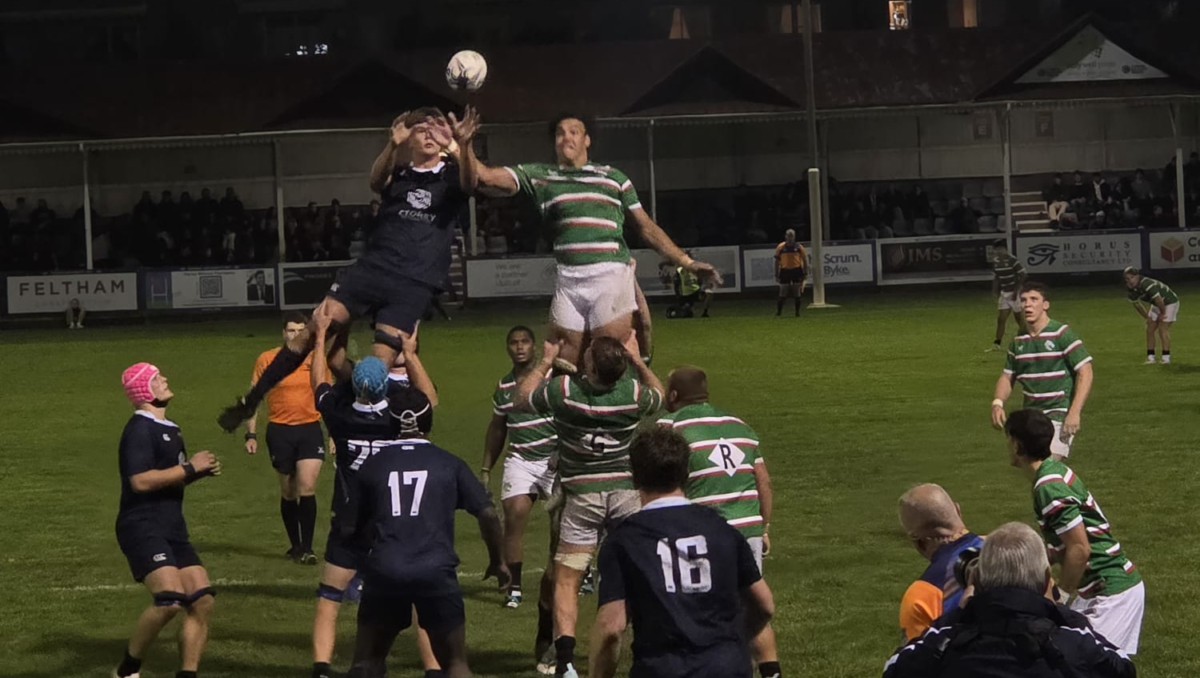 OURFC and Leicester Tigers forwards jump for the ball from a lineout.