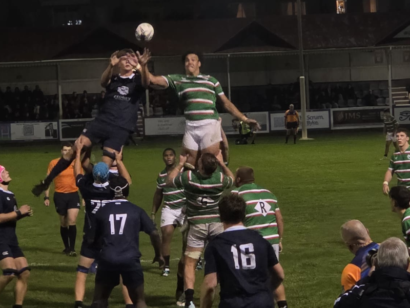 OURFC and Leicester Tigers forwards jump for the ball from a lineout.