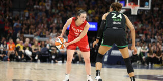 Caitlin Clark and Napheesa Collier face off on a basketball court.