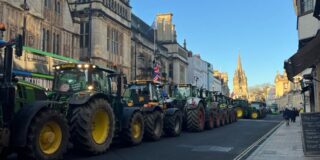 Image of green tractors parked along Oxford High Street