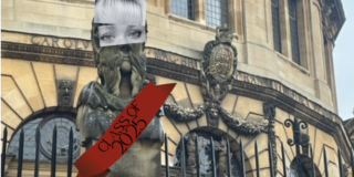Photo of a statue outside the Sheldonian Theatre. The statue has a girl's eyes and fringed superimposed onto it, and is wearing a sash that reads "Class of 2025"