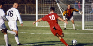 man about to kick football