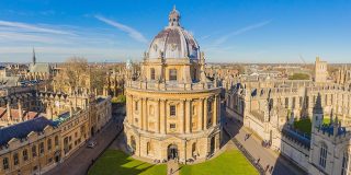 Radcliffe Camera, a cylindrical library in central Oxford, is pictured centrally among the Oxford skyline, as taken from University Church