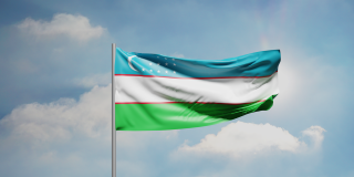 The flag of Uzbekistan blowing in the wind