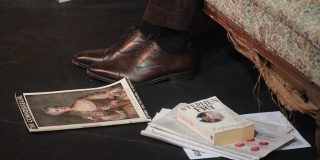A photo of shoes, magazines and books on the set of the show