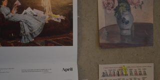 This image shows a picture of a pin-board wall, with a calendar and image of flowers on.