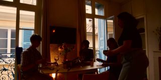 A group of friends setting up a meal together