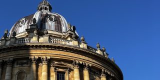 An image of the Radcliffe Camera against a blue sky