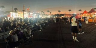 People outside at dusk.