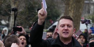 Tommy Robinson surrounded by a crowd
