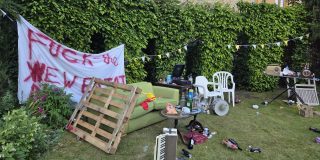 A garden, covered in litter and assorted furniture.