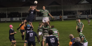 OURFC and Leicester Tigers forwards jump for the ball from a lineout.